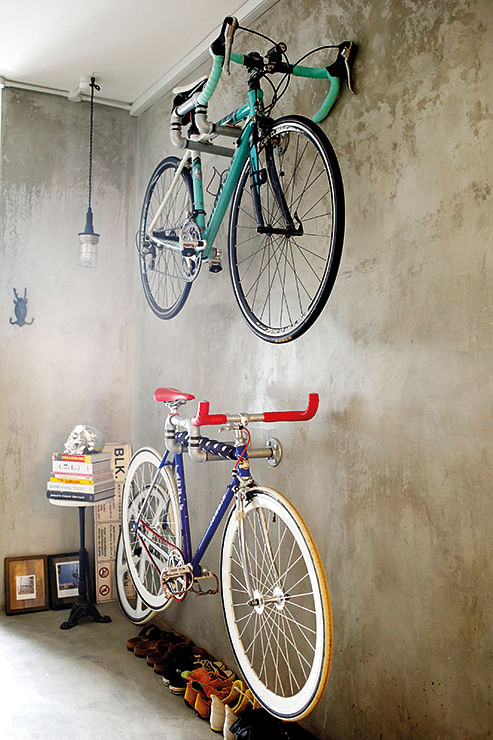 Photographer and avid cyclist Frenchescar Lim admires the aesthetics of bicycles, and proudly displays her self-assembled pieces in her kitchen area.