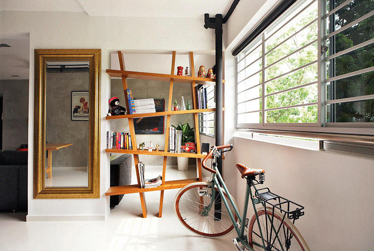 This vintage bicycle adds an element of charm and nostalgia to the space. Interior design by Fuse Concept.