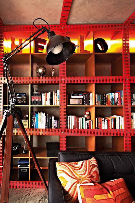 Concealed lighting strips illuminate the bookshelves from the inside, highlighting the cutouts of the cable trays. (Reno: $128K)