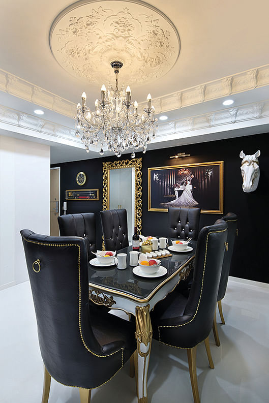 The homeowners' wedding picture, displayed in pride of place in the dining room in this 3-bedroom condominium for a family of 4.