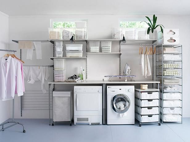 Laundry area in a house with a condensor clothes dryer, washing machine, ironing board, and shelves for laundry accessories. Home and Decor Singapore. (image: DIY network)