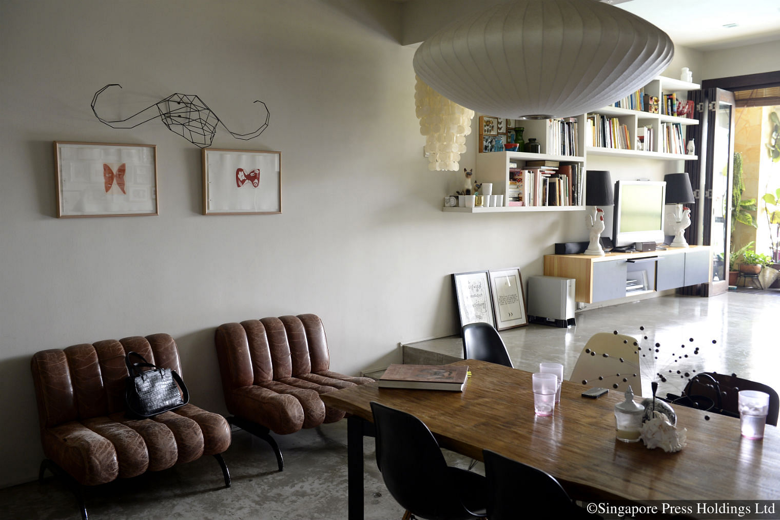 Two used leather chairs in the living room of Ms Goh Ling Ling's apartment in Toh Tuck Road. Ms Goh, who owns artisanal bag designer label Ling Wu, bought the mid-20th century, German-made chairs from a friend who used to deal in vintage furniture here.