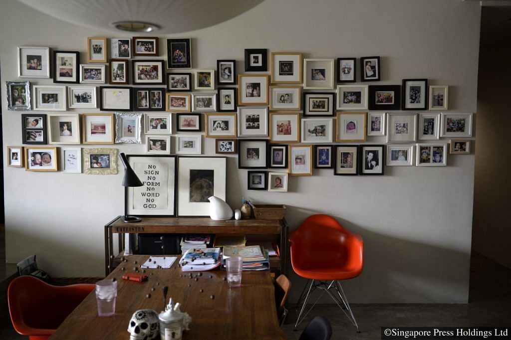 The walls of Ms Goh Ling Ling’s apartment in Toh Tuck Road display not only artworks, but also framed snapshots of the family. Ms Goh owns artisanal bag designer label Ling Wu. 