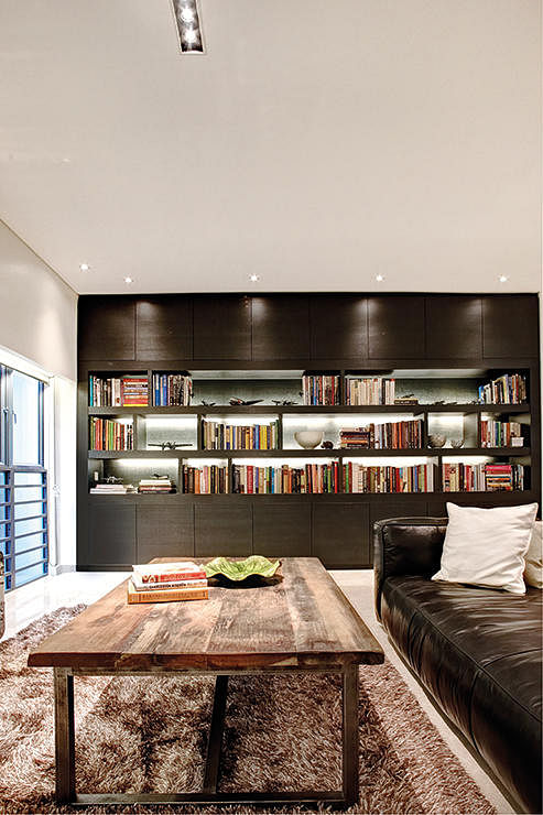 Interior designer wanted to create a warm and cosy library-like den for the living area.