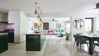 Homeowner Gayatri had bought over the unit from its previous owners, opting to retain and design around most of its existing features, such as the two kitchen islands, tiles, the sliding bar in the dining room.